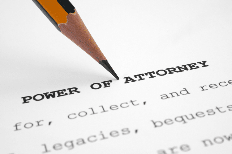 paper saying power of attorney, with a pencil