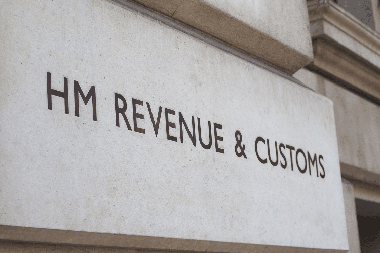 The words 'HM Revenue and Customs' printed on the wall of a building.